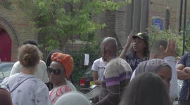 Local community shouting at a women journalist wearing hijab reporting for the Grenfell Tower fire