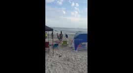 Man catches shark...priceless reaction