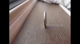 Coin balance test on China's first domestically-built bullet train