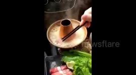Amateur chef cooks Chinese food in her car