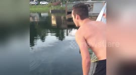 Man catches large dogfish with his bare hands