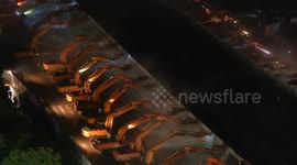 Hundreds of excavators demolish overpass in one night