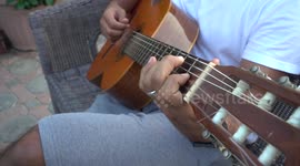 Guitar playing in slow-mo 