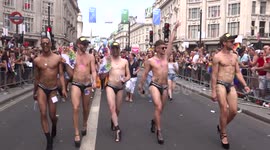 Group of gays in bikini marshes for London Pride