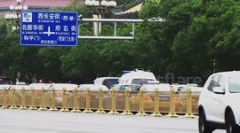 Golden guardrails glitter on Beijing's Chang'an Avenue