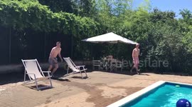 Man's amazing dive through inflatable flamingo