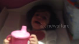 Baby play's with water and makes gargles