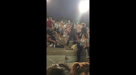 Man beats his wife during a huge charity music concert in Athens