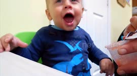 Baby has very funny response to eating apple sauce