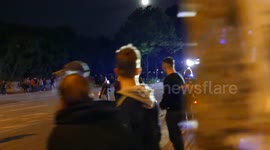 Police truck shooting water from cannon during gathering at G20 protest