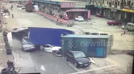 Miraculous survival after truck flips onto four cars  in  China