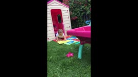 Summer fun in her wendy house