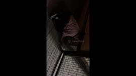 Girl trying to get home through a hall in fence