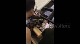 Woman slaps airport staff member after learning her flight was cancelled