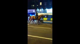 Riot police deployed in Dalston, London during violent protest