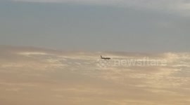 Airplane take off filmed from another.