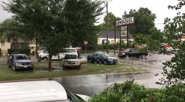 Cars park and wait during heavy rainfall causing flooding new orleans