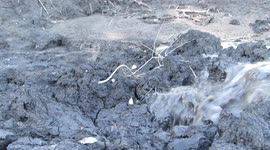 At the very front end of a river coming down