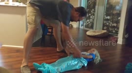 Dad ‘turbo spins’ daughter around lounge at high speed