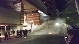Armed police fire tear gas at anti-Trump protesters