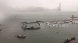 T8 Typhoon Pakhar sweeps across Victoria Harbour, Hong Kong