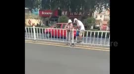 Elderly man trying to cross the road gets stuck on central reservations