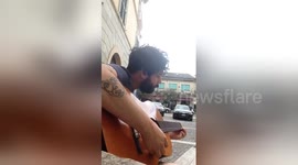 Newsflare Edit - Playing a two string guitar in Atina, Italy