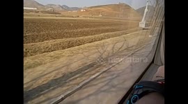 North Korea. DPRK. Kaesong (5) Video from the bus, bicycles and weapon monument. 2015