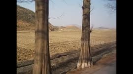 North Korea. DPRK. Kaesong (7) Video from the bus, digging with weird system pulling ropes. 2015