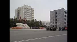 North Korea. DPRK. Pyongyang IV. Mansudae Art Studio. Offering flowers leader statuer. 2015