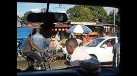 Madagascar. Toamasina. Traffic, market, carrying potatoes bag. 2015