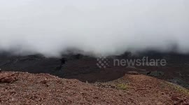 Galapagos clouds rolling in on a volcano