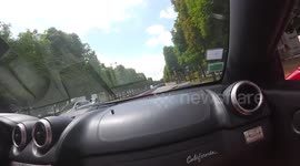 Ferrari speeding through paris