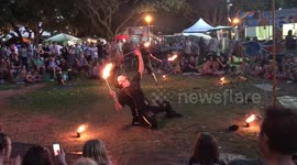 Man grabs fire voraciously...