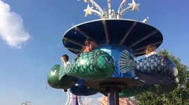 Unhappy toddler on carnival ride