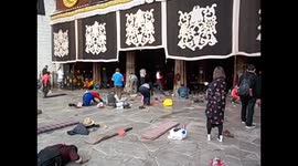 Tibet. Lhasa I. (4) Barkhor. Pilgrims bowing in front of Jokhang temple. 2015