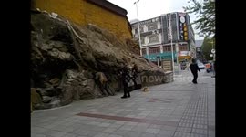 Tibet. Lhasa IV. (1) Pilgrims rubbing themselves against holy rocks. 2015