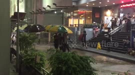 Good Samaritan security guard ferries shoppers through the rain