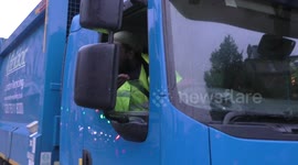 Aggressive lorry driver tries to run pass protesters blocking the road in London, UK
