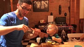 Dad explains science trick by sticking food to babys forehead