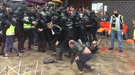 Spanish police throw Catalan voters to the ground