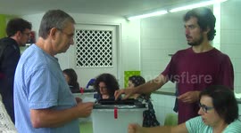 depositing the ballot paper in the ballot box of the Catalonian self-determination referendum