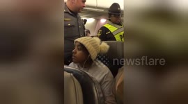 Newsflare Edit - Liberal being escorted off plane front view