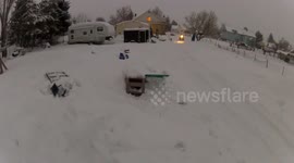 Jumping a snow bike in the back yard being towed by a fourwheeler