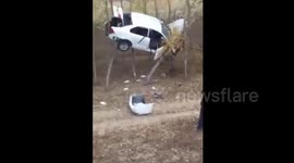 Crashed car trapped in trees in China