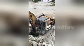 Six-year-old boy operates digger on Bangkok building site