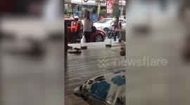 Chinese tourist rams cop then knocks mother and daughter off moped