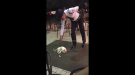 Stubborn cat refuses to leave her favourite spot at the front of busy shopping mall