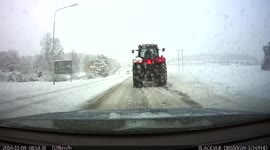 Rural snowy road in Sweden during snowfall