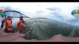 Falling into the water with parachute 360°